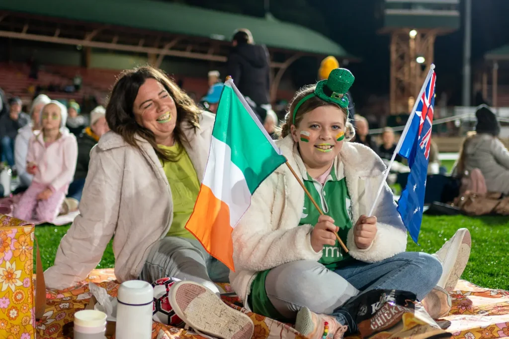 Family supporting the Matildas with Australian and Irish flags at North Sydney Oval