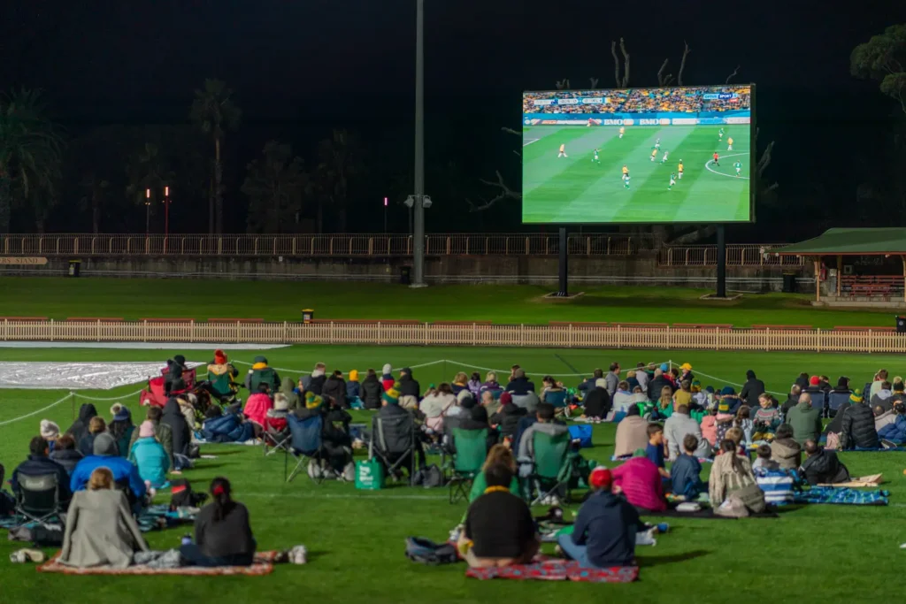 Crowd watching the Matildas match on the big screen at North Sydney Oval live site