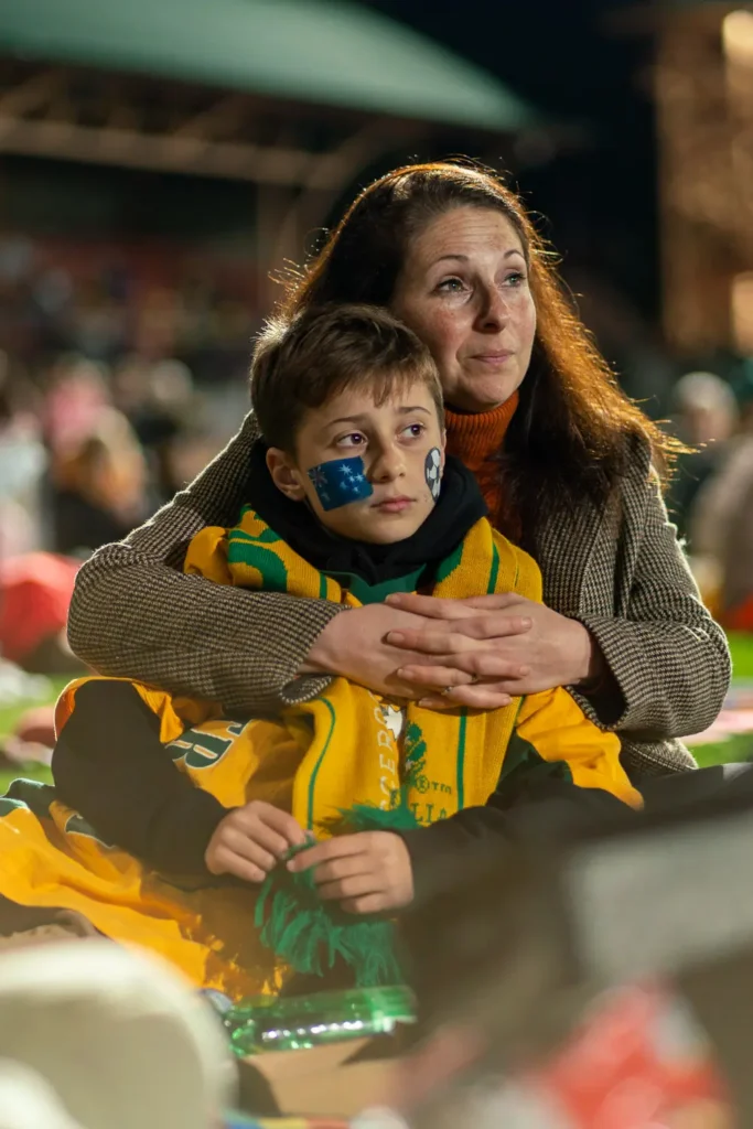 Mother and son watching the Matildas match together at North Sydney Oval live site