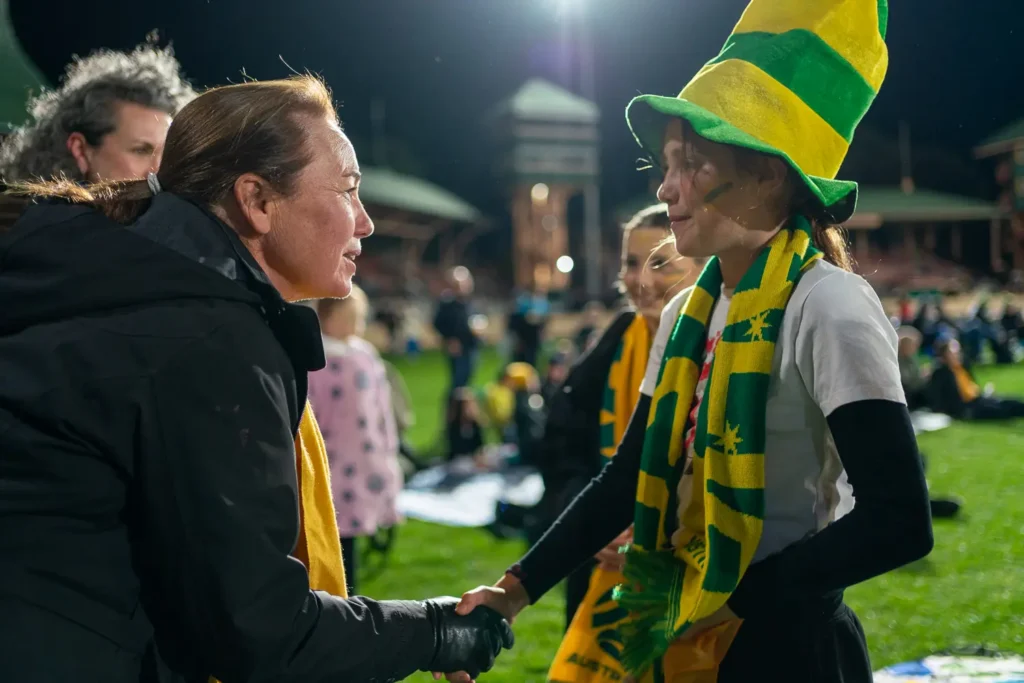 Therese Cole greeting young Matildas supporter at North Sydney Oval live site