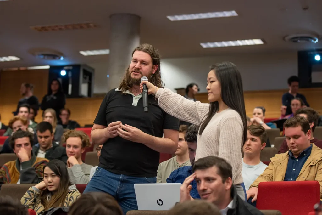 Audience participation during the Socialism vs Capitalism debate at the University of Sydney