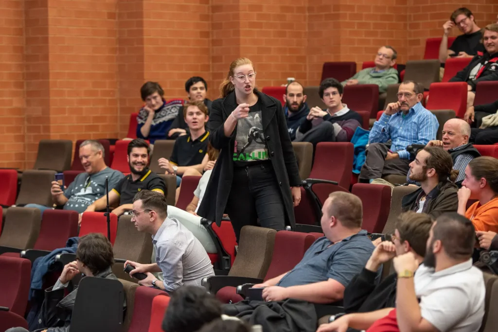 Audience member asking a question during the University of Sydney debate