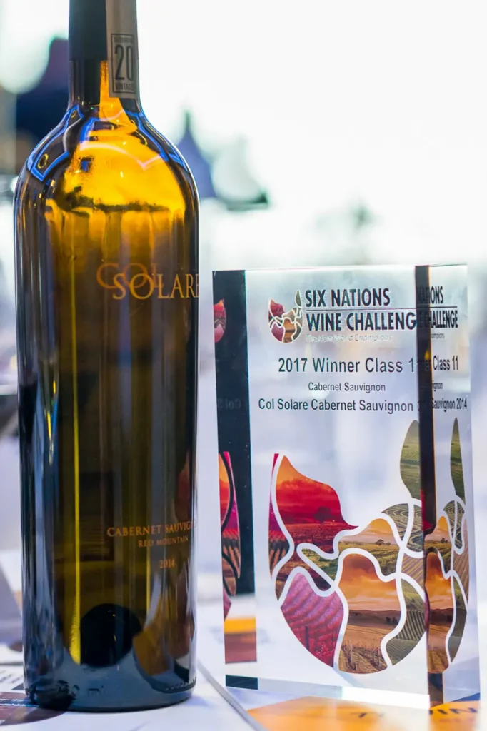 Col Solare Cabernet Sauvignon bottle beside a 2017 Six Nations Wine Challenge winner award