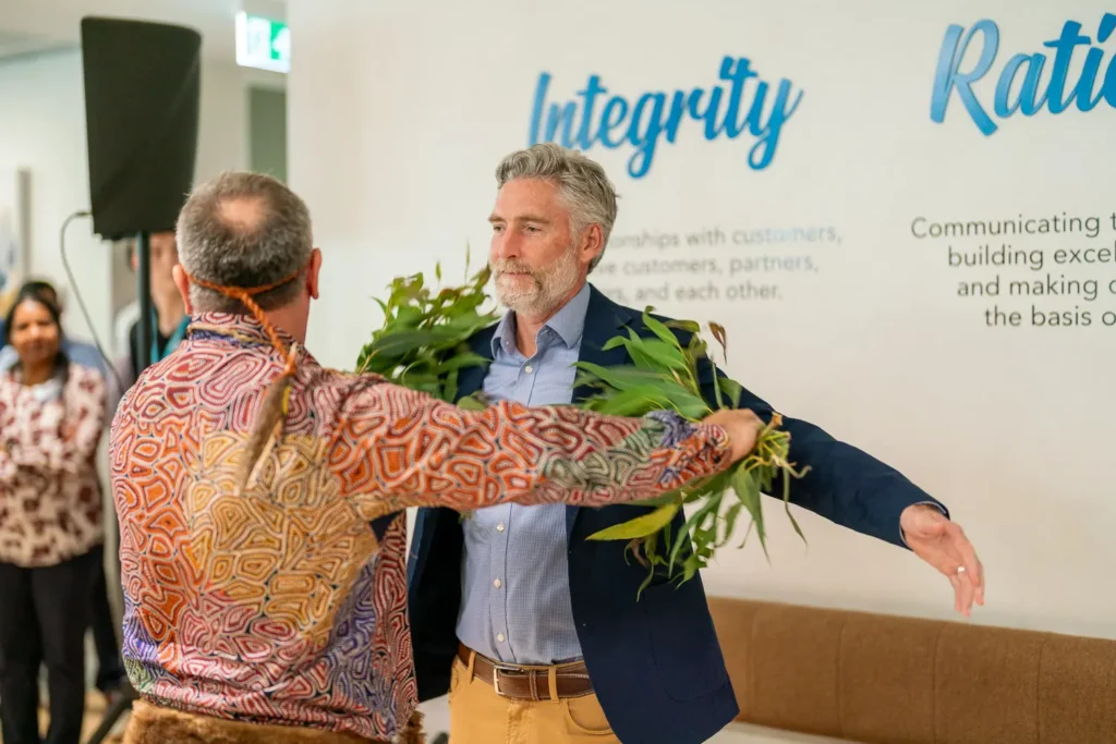 Aboriginal brushing ceremony with native branches at the Guidewire Sydney office opening