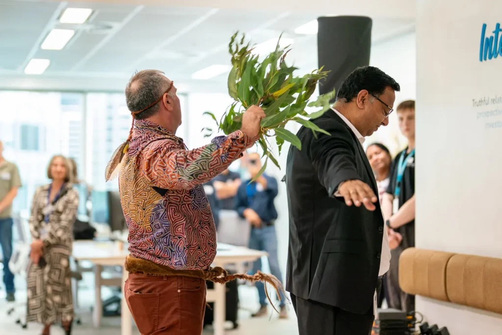 Aboriginal brushing ceremony with native branches at Guidewire's new Sydney office