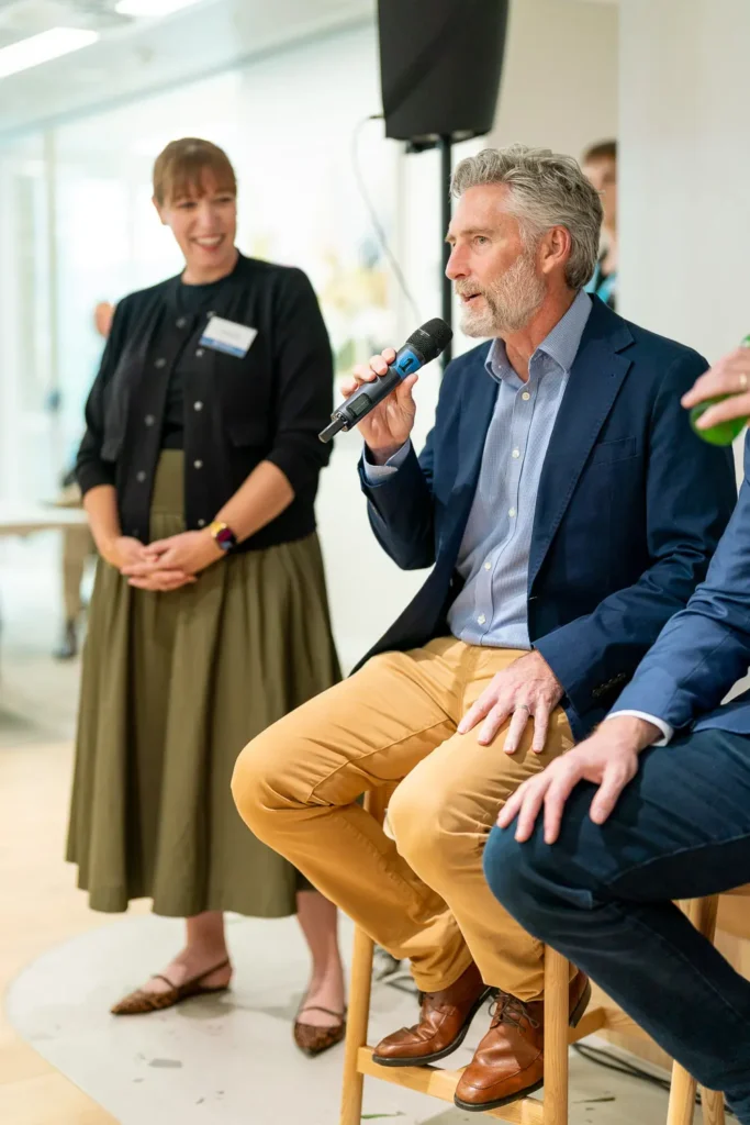 Guidewire executive speaking to colleagues at the Sydney office opening