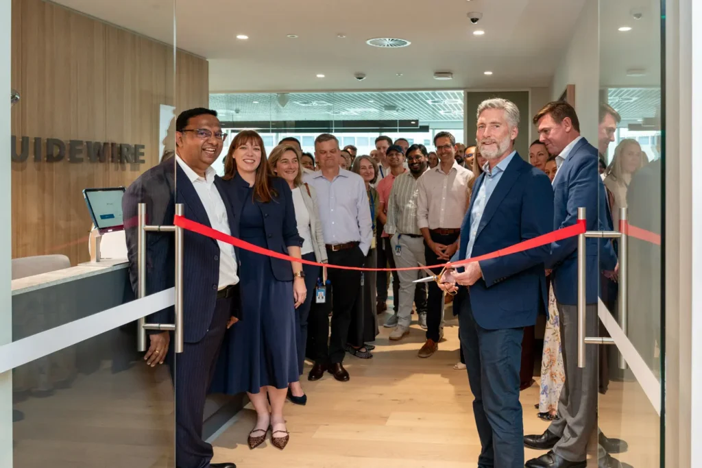 Guidewire team celebrating the Sydney office opening with an official ribbon cutting
