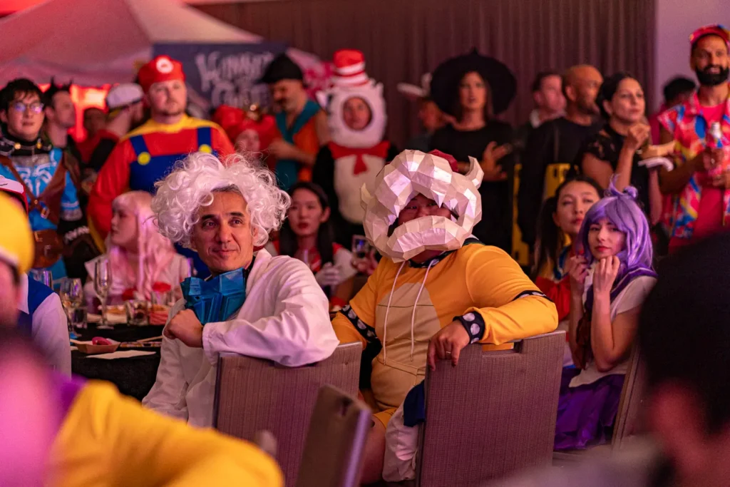 Guests watching the entertainment in costumes at Quantum Day 2023