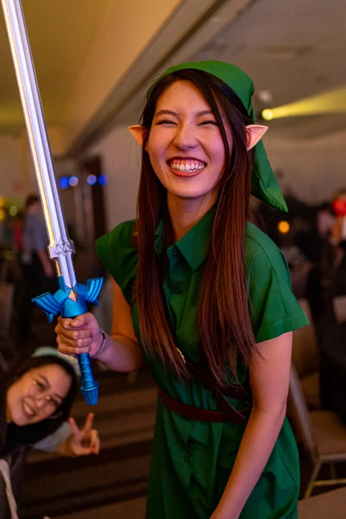Smiling guest in costume at Quantum Day 2023