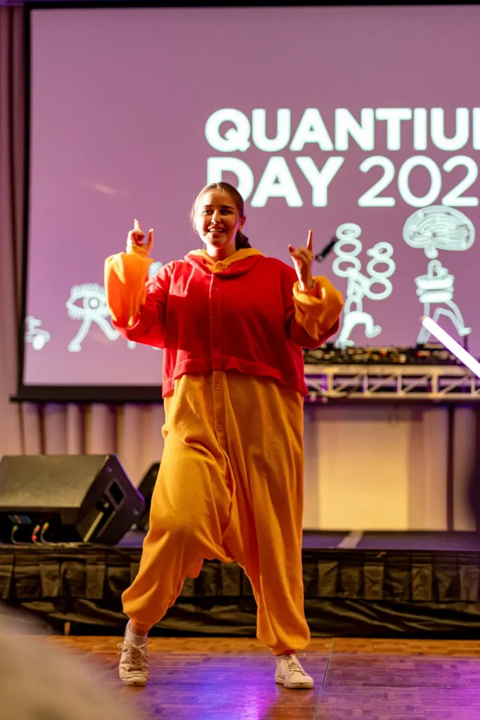 Costumed performer on stage during Quantum Day 2023