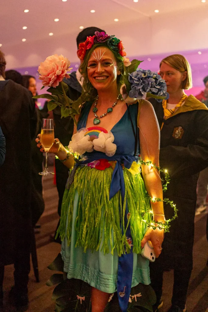 Guest in a colourful costume at the Quantum Day company celebration