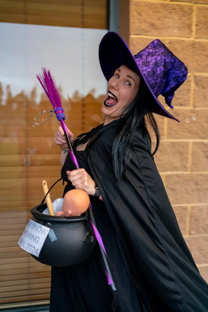 Guest in a witch costume at the Quantum Day 2023 company celebration
