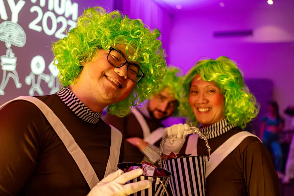 Guests in colourful costumes at Quantum Day 2023 corporate celebration