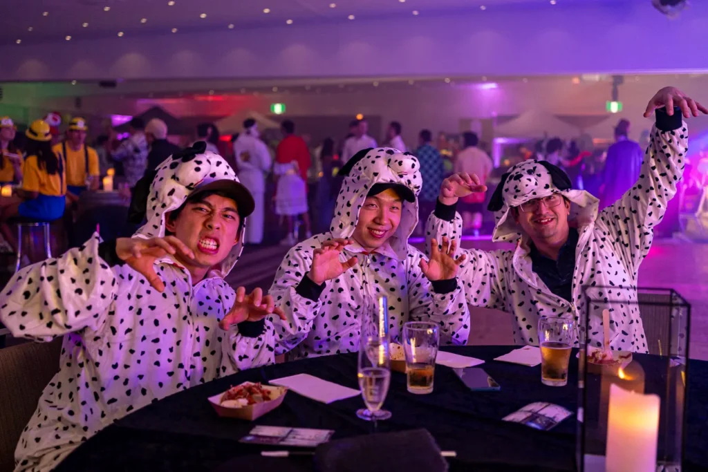 Guests in Dalmatian costumes enjoying the Quantum Day party