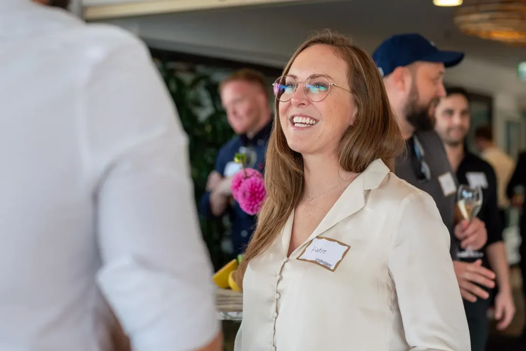 Guest enjoying a conversation at the SHIFT Soirée at The Boathouse