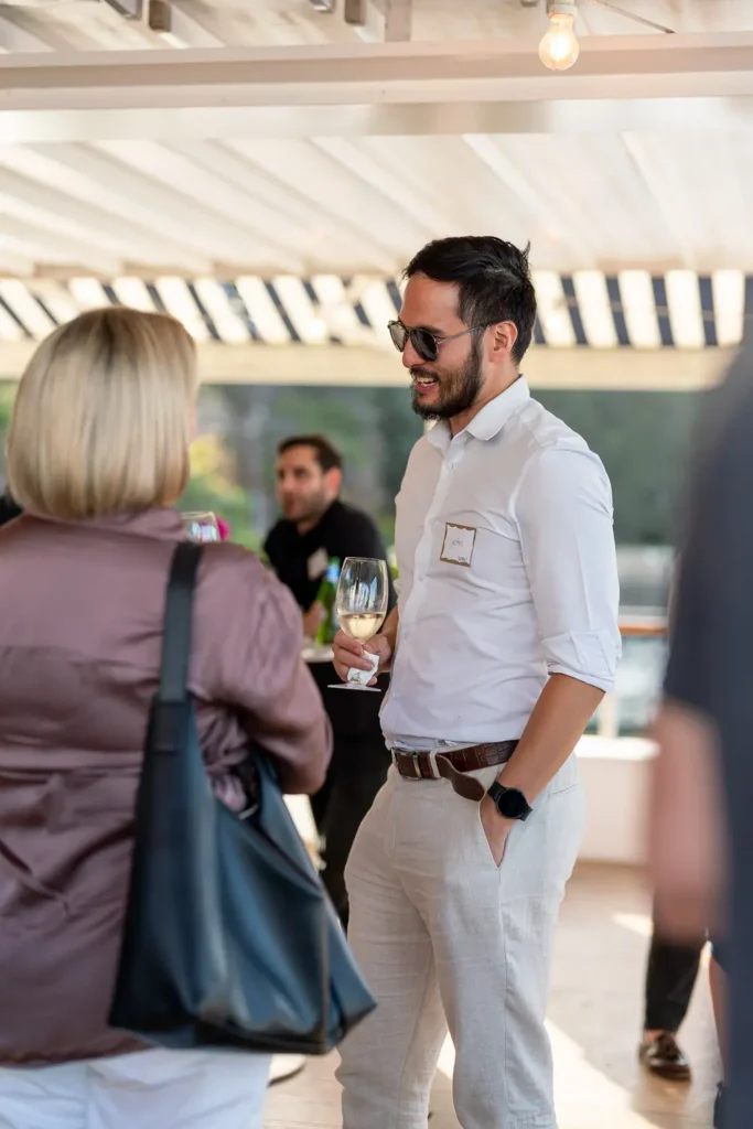Guest networking over drinks at The Boathouse Rose Bay