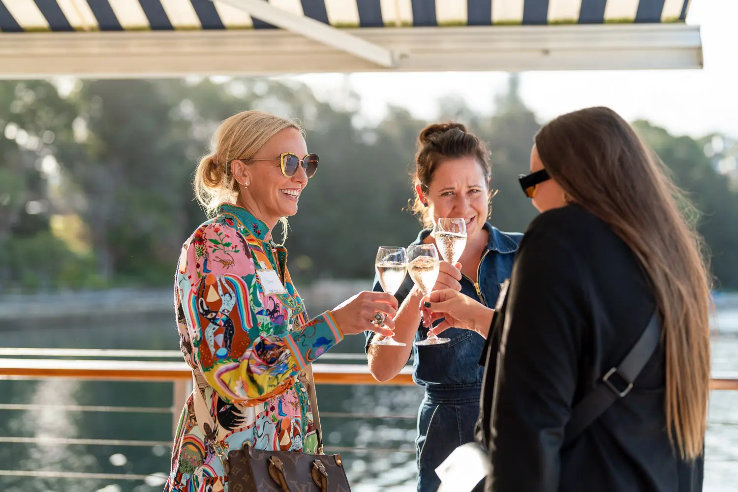 Guests enjoying drinks by the water at the SHIFT Soirée in Rose Bay