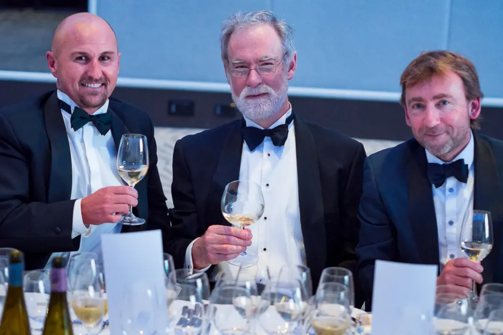 Guests raising wine glasses at the 2017 Six Nations Wine Challenge awards dinner