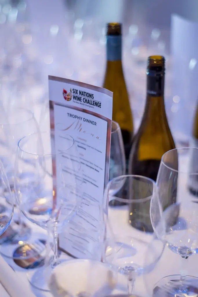 Six Nations Wine Challenge trophy dinner table with wine bottles and tasting glasses