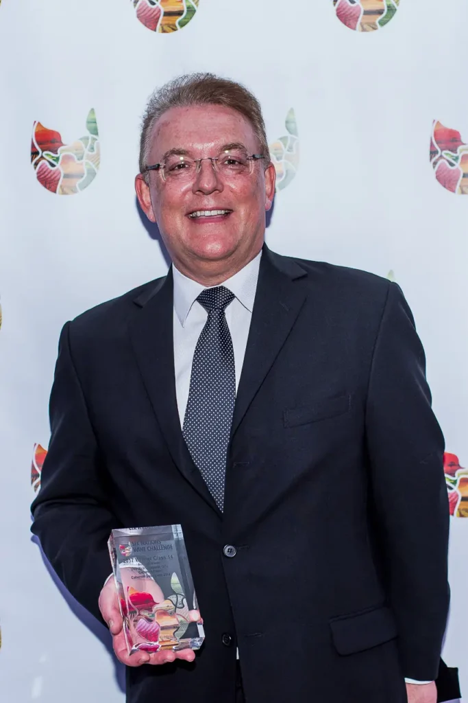 Trophy winner holding an award at the 2017 Six Nations Wine Challenge in Sydney