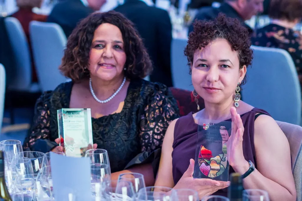 Guests holding winner trophies at the Six Nations Wine Challenge awards dinner