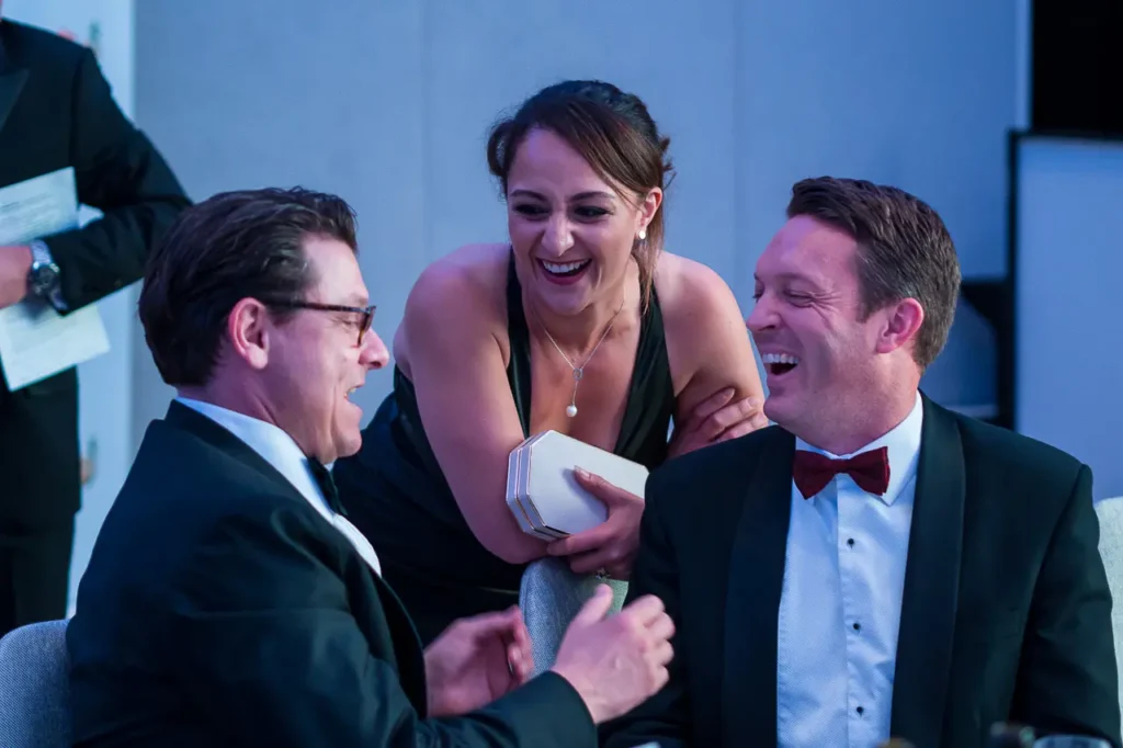 Guests sharing a laugh during the Six Nations Wine Challenge dinner