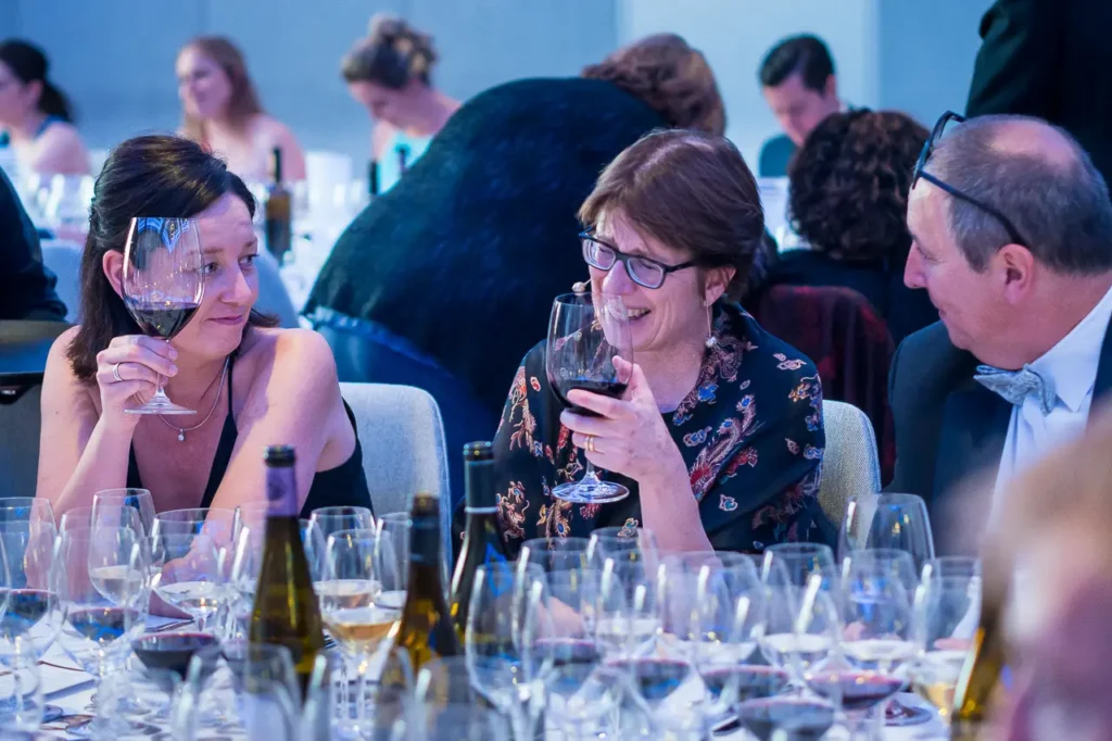 Guests enjoying red wine together at the Six Nations Wine Challenge dinner