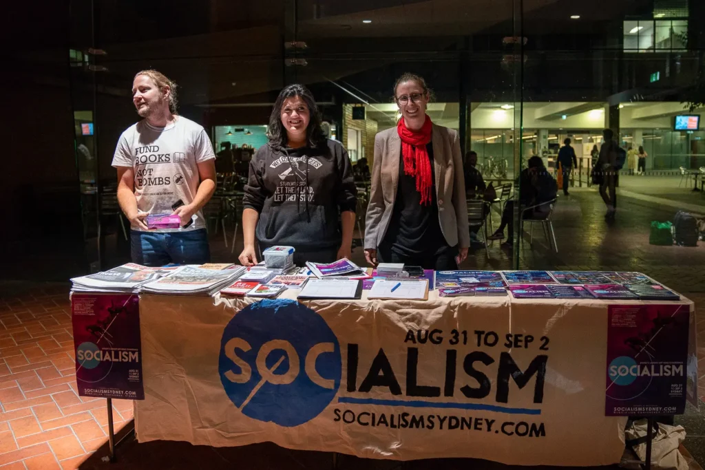 Volunteers at a Socialism conference registration and information desk