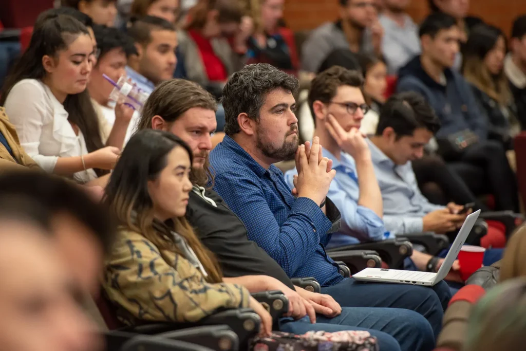 Students listening closely during an event at the University of Sydney