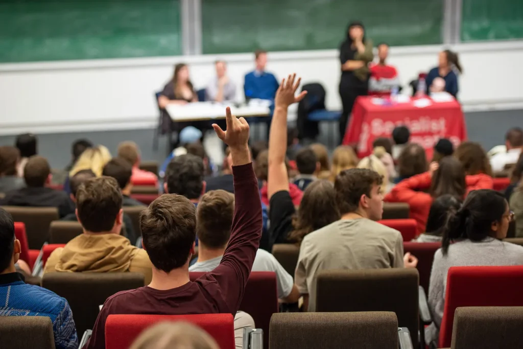 Student asking a question inside Eastern Avenue Auditorium at the University of Sydney