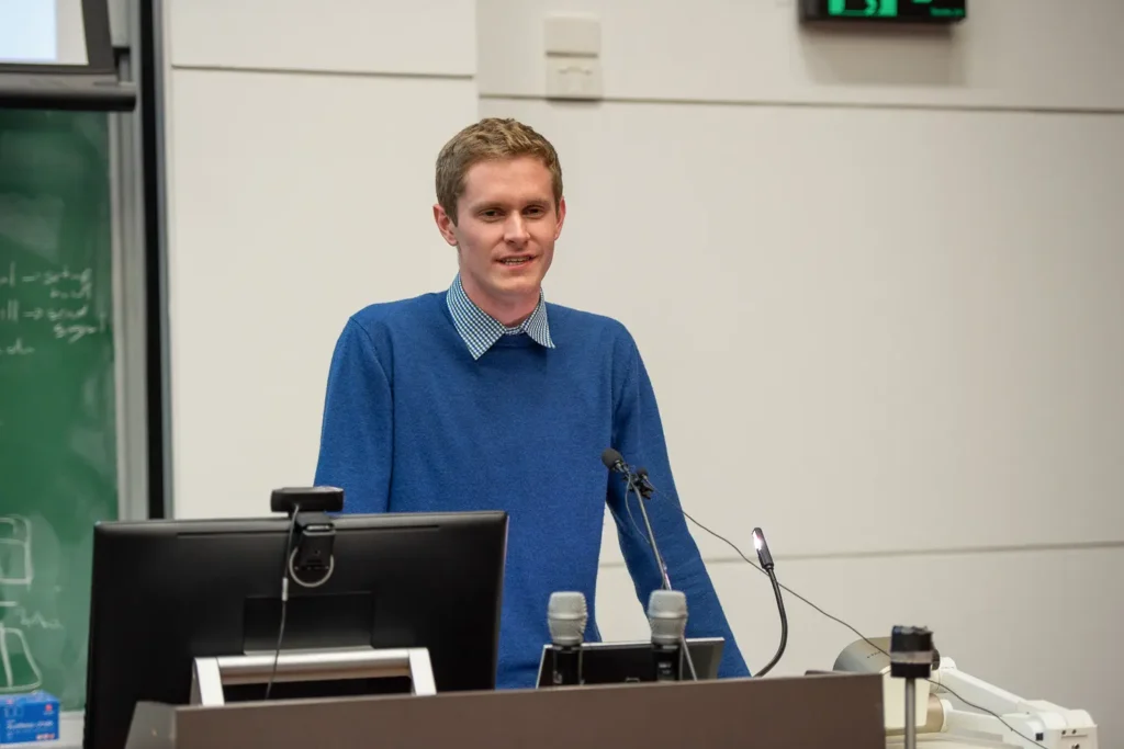 Speaker addressing the Socialism vs Capitalism debate at the University of Sydney