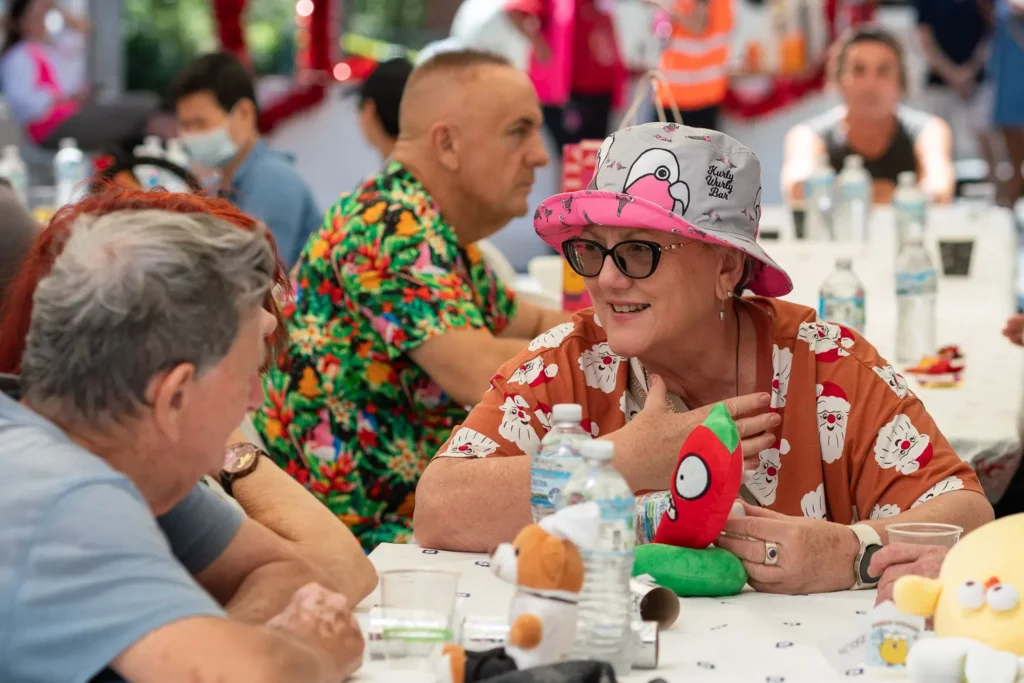 Guests sharing conversation around the table at the Wayside Chapel Christmas Day lunch
