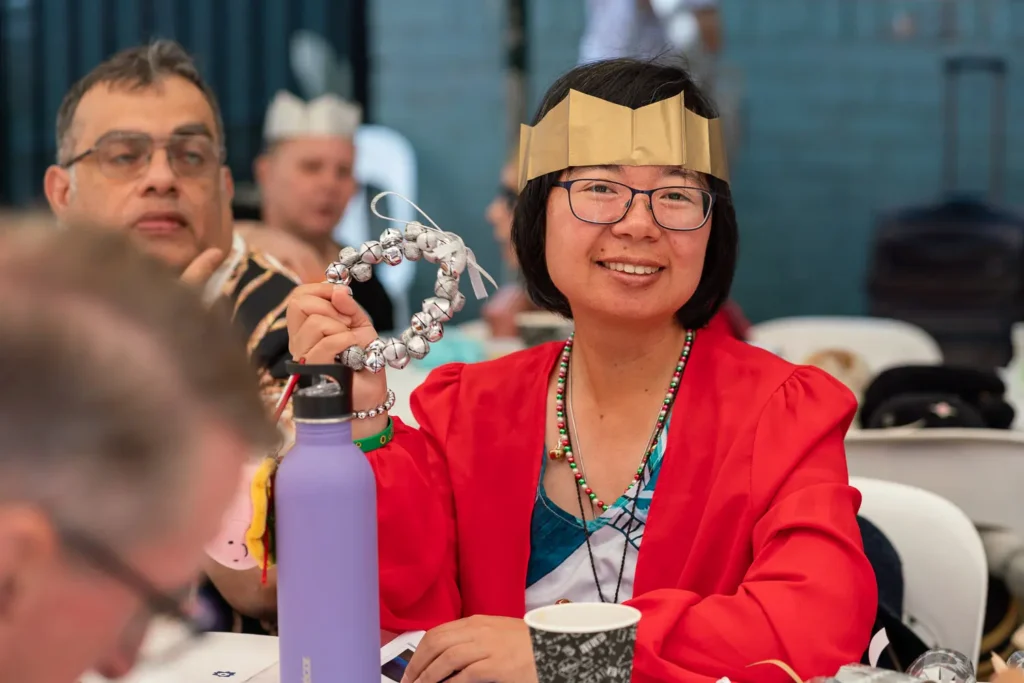 Guest wearing a Christmas crown at the Wayside Chapel Christmas Day lunch