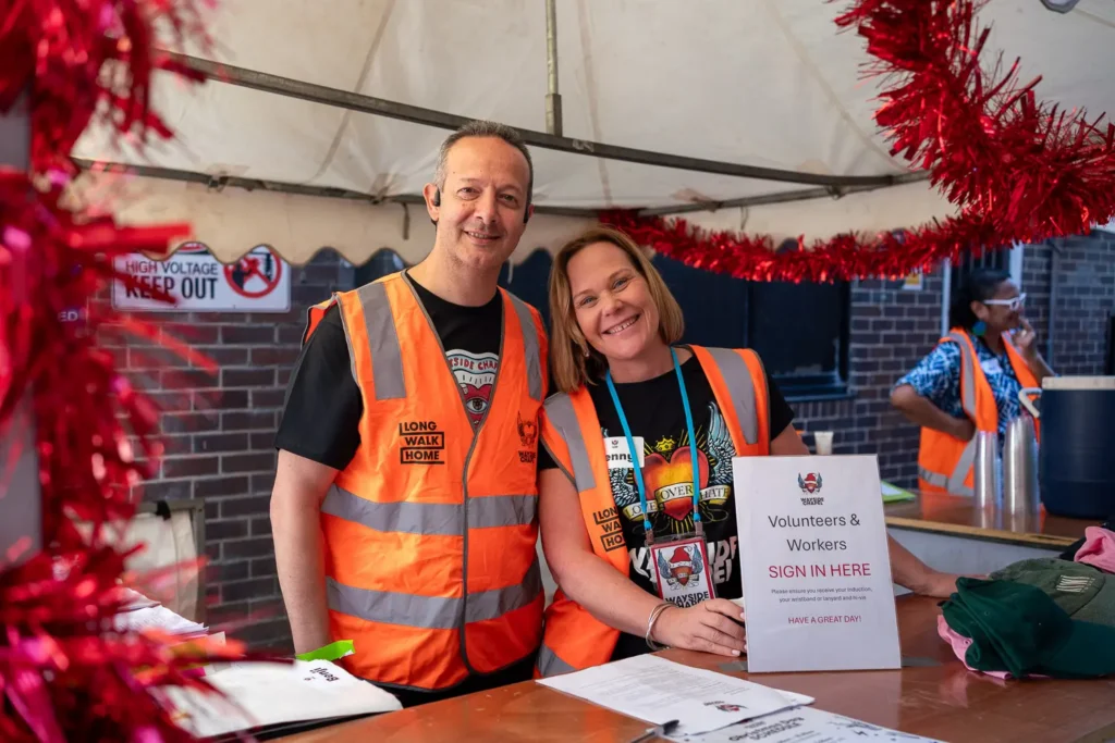 Wayside Chapel volunteers welcoming guests at the Christmas lunch