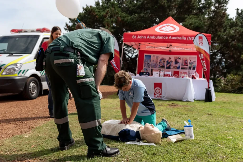 Expo event photographer Sydney capturing a St John first aid demonstration