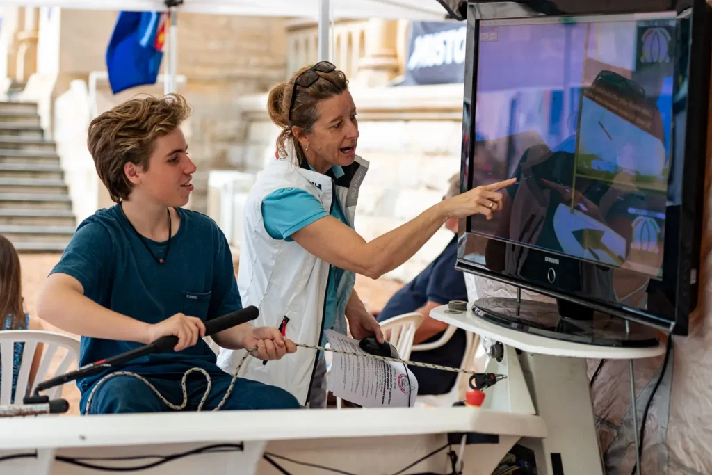 Interactive sailing demonstration with visitors photographed at a Sydney expo event