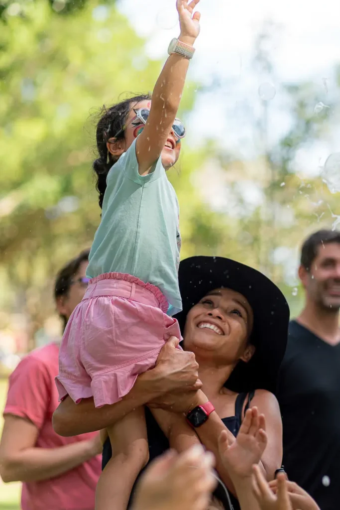 Event photography capturing family fun and bubbles at the St Leonards Park playground opening