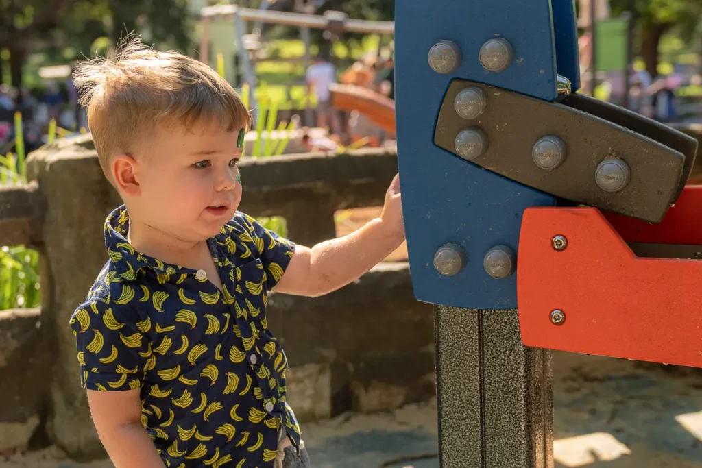 Event photography capturing families and children throughout the St Leonards Park playground opening