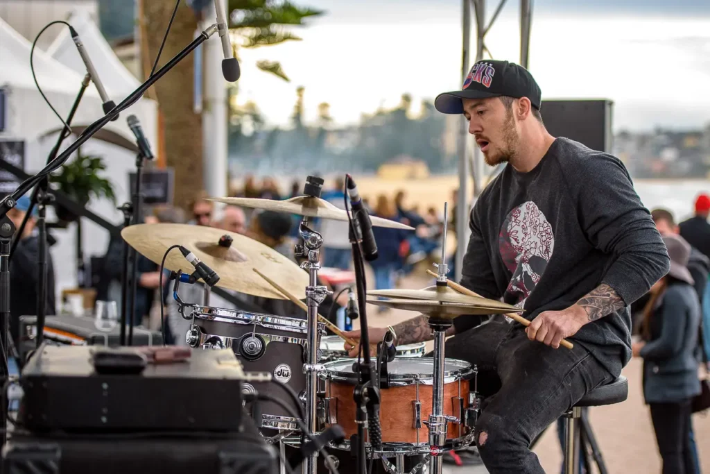 Live drummer performing beside Manly Beach at Taste of Manly