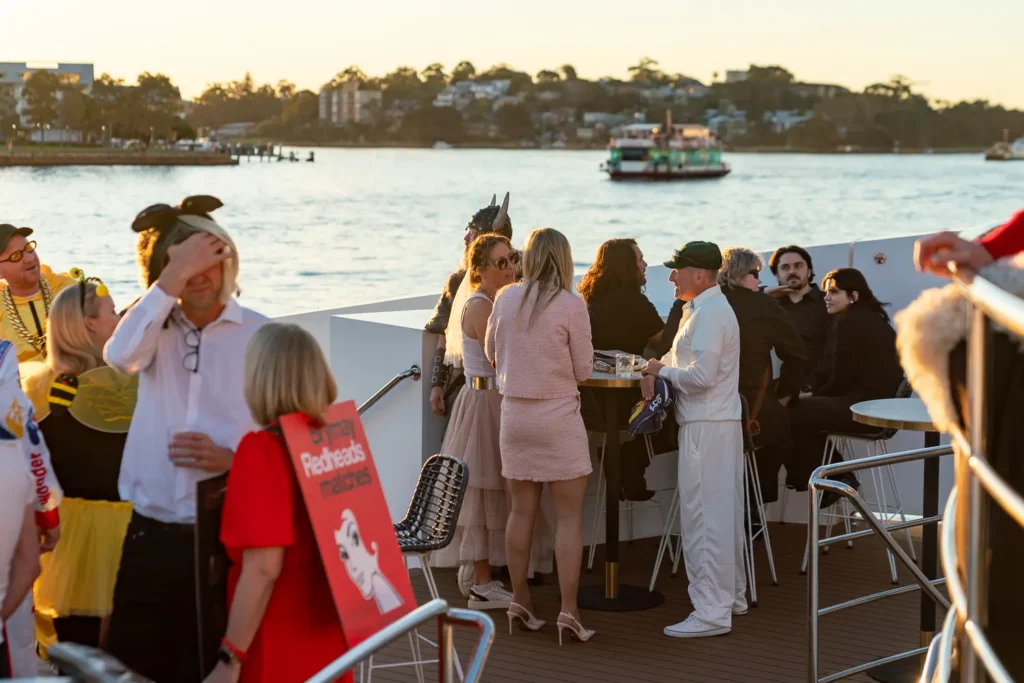 Friends enjoying a costume birthday party aboard The Jackson on Sydney Harbour